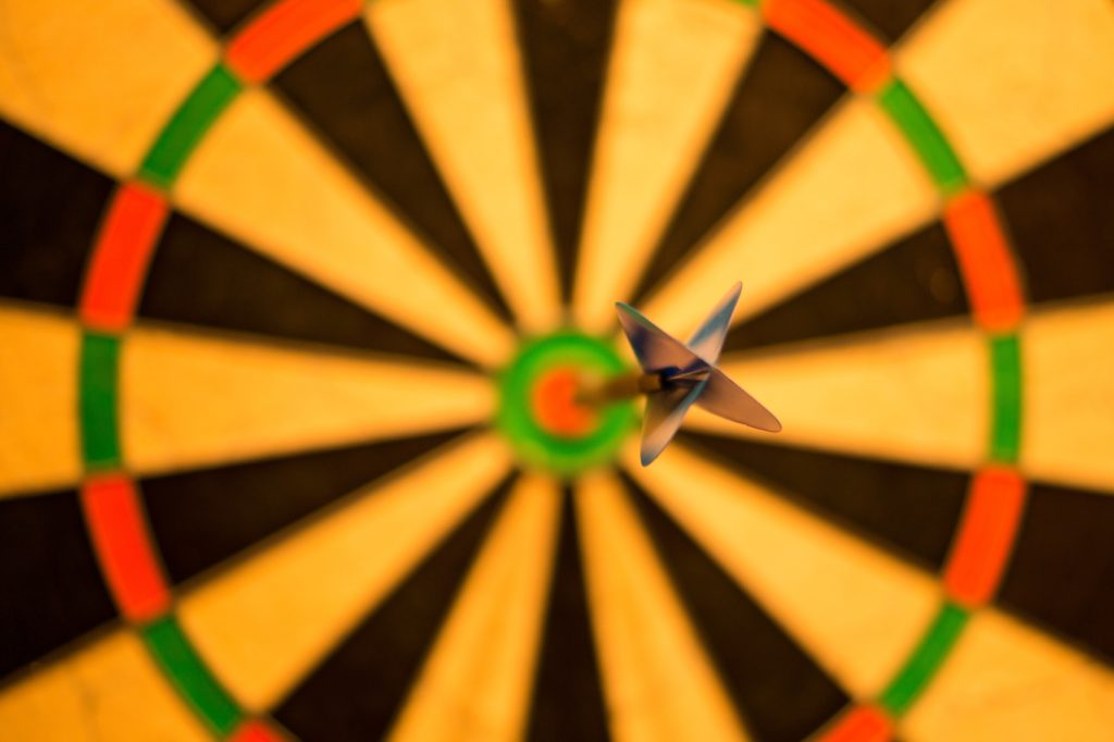 how to set up facebooks retargeting ads; dartboard with a dart in the bullseye