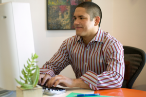 Man at computer successfully nurturing his email leads