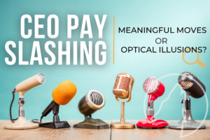Line of microphones sit on a table. Text: CEO pay slashing--meaningful moves or optical illusion?